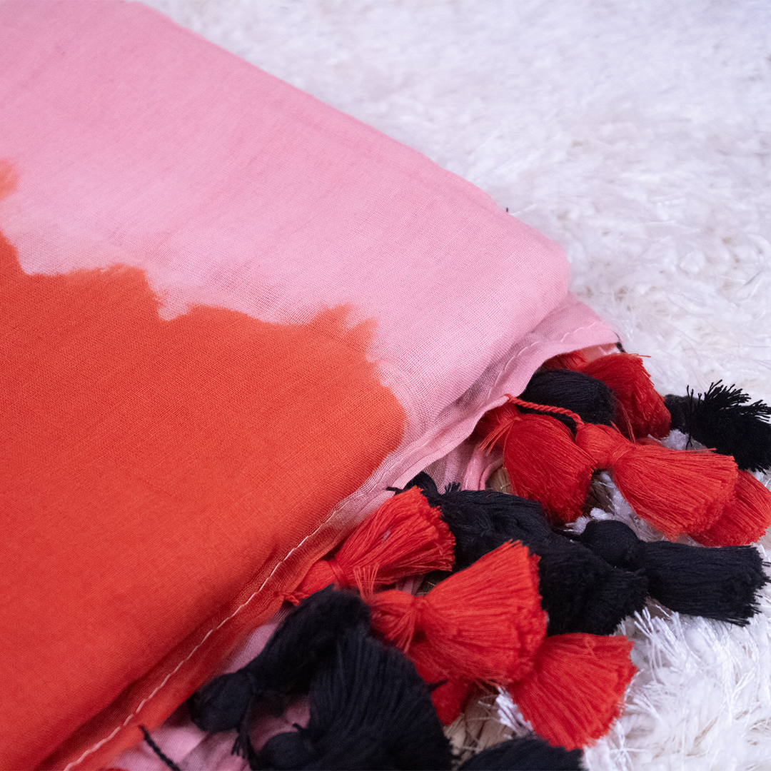 Tie Died Red and Pink Mul-Cotton Saree with red and black tassles
